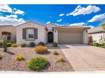 Single-story home with desert landscaping and a two-car garage at 32508 N 133Rd Dr, Peoria, AZ 85383