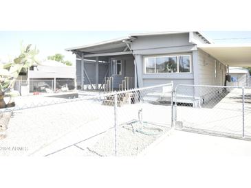 House exterior with gray siding and chain link fence at 17836 N 21St St, Phoenix, AZ 85022