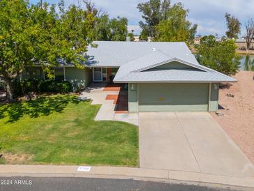 Front view of a single-story home with a two-car garage at 4906 E Lake Point Cir, Phoenix, AZ 85044
