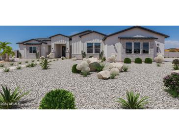 Stunning curb appeal with desert landscaping and stone accents at 9658 E Flanders Rd, Mesa, AZ 85207