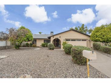 House front with a well-maintained lawn and mailbox at 9626 N 35Th Ln, Phoenix, AZ 85051