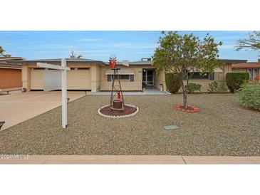 Ranch style home with carport and landscaped front yard at 552 S Roanoke --, Mesa, AZ 85206