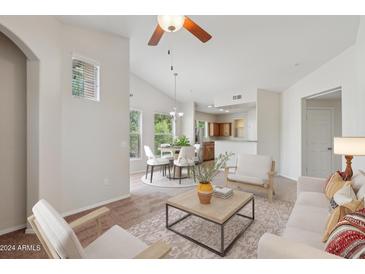 Bright living room with comfy seating and dining area at 14575 W Mountain View Blvd # 221, Surprise, AZ 85374