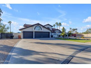 Beautiful home with three-car garage and landscaped yard at 12222 N 74Th St, Scottsdale, AZ 85260