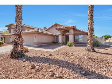 Beautiful curb appeal with a well-maintained front yard and landscaping at 1639 E Redfield Rd, Gilbert, AZ 85234