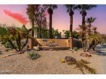 Community entrance with signage and landscaping at 14950 W Mountain View Blvd # 1203, Surprise, AZ 85374