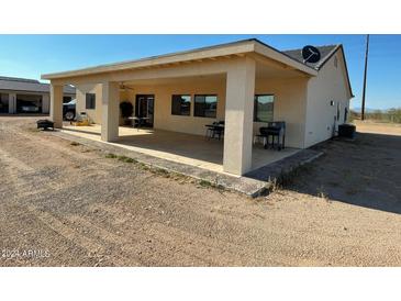 Covered patio, grassy lawn, and a spacious backyard at 1527 E Germann Rd, San Tan Valley, AZ 85140