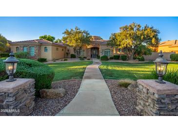 Luxury home with stone accents and landscaped yard at 2068 E Tiffany Ct, Gilbert, AZ 85298