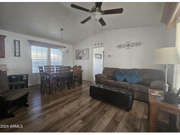 Open living room with wood floors and seating area at 8700 E University Dr # 339, Mesa, AZ 85207