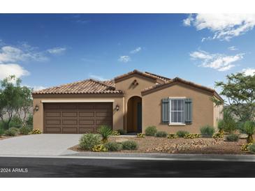 Tan single story home with brown garage door and green shutters at 5928 S 246Th Ln, Buckeye, AZ 85326
