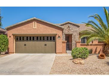 Charming one-story home with a two-car garage and well-maintained landscaping at 26723 N 127Th Dr, Peoria, AZ 85383