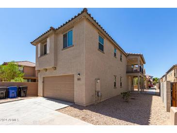 Two-story home with garage and balcony at 847 E Agua Fria Ln, Avondale, AZ 85323