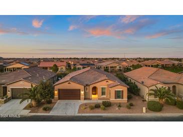 Aerial view of a single-story home in a residential community, featuring a desert landscape at 41758 W Cribbage Rd, Maricopa, AZ 85138
