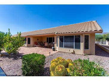 Inviting patio with tiled flooring and desert landscaping at 8561 E Yucca Blossom Cir, Gold Canyon, AZ 85118