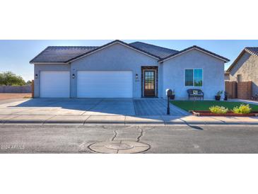 New construction home with two-car garage and landscaped front yard at 1579 N Himosa Dr, Casa Grande, AZ 85122