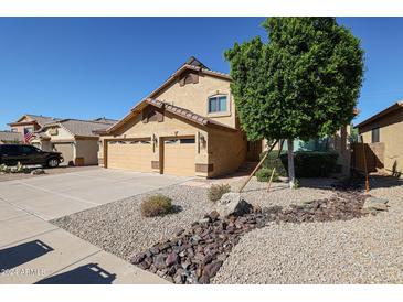 Two-story house with a three-car garage and landscaped yard at 26028 N 66Th Dr, Phoenix, AZ 85083