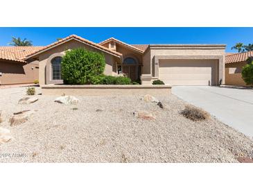Charming single-story home with a two-car garage at 9214 W Kerry Ln, Peoria, AZ 85382