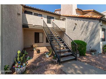 Exterior view of building with stairs and landscaping at 19820 N 13Th Ave # 226, Phoenix, AZ 85027