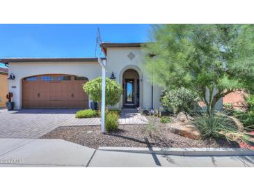 Single-story home with a brown garage door and landscaped front yard at 35532 N Sunset Trl, San Tan Valley, AZ 85140