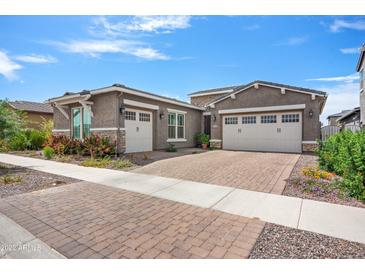 Two-story home with a two-car garage and nicely landscaped yard at 10020 E Strobe Ave, Mesa, AZ 85212