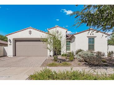 Charming one-story home with a neutral color palette and landscaping at 10348 E Tupelo Ave, Mesa, AZ 85212