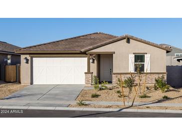 One-story home with a two-car garage and desert landscaping at 20314 N 224Th Dr, Surprise, AZ 85387