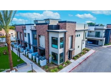 Modern townhome with private patio and walkway at 142 E Hearne Way, Gilbert, AZ 85234
