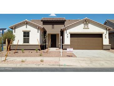 Two-story home with a two-car garage and desert landscaping at 21042 E Camina Buena Vis, Queen Creek, AZ 85142