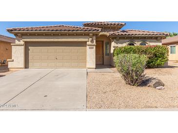 House exterior featuring a two-car garage and well-maintained landscaping at 864 E Riviera Pl, Chandler, AZ 85249