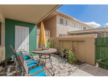 Relaxing patio with seating and a storage shed at 6565 N 19Th Ave # 21, Phoenix, AZ 85015