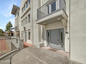 Exterior view of building showing entrance and walkway at 1081 W 1St St # 7, Tempe, AZ 85281