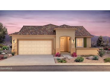 Tan house with tile roof, garage, and landscaping at 7691 W Cactus Wren Way, Florence, AZ 85132