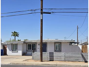 Charming single story home with modern gray fence at 206 N 5Th St, Avondale, AZ 85323