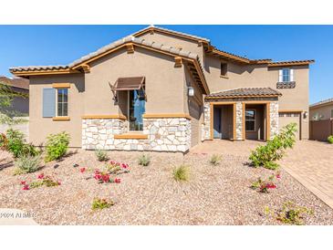 Two story home with stone accents and landscaping at 8628 W Solano Dr, Glendale, AZ 85305