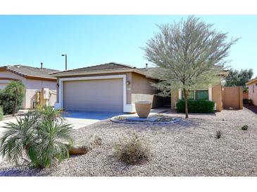 Charming single-story home with a two-car garage and well-manicured front yard at 3771 E Hazeltine Way, Chandler, AZ 85249