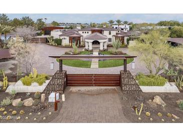 Luxury home with gated entry and circular driveway at 21423 S 147Th St, Gilbert, AZ 85298