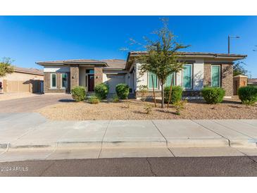 Single-story home with landscaped yard and two-car garage at 5309 N 148Th Ave, Litchfield Park, AZ 85340