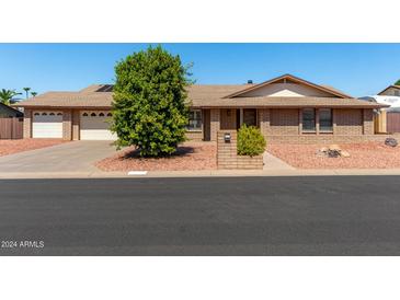 Brick ranch house with two-car garage at 6034 E Hillview St, Mesa, AZ 85205