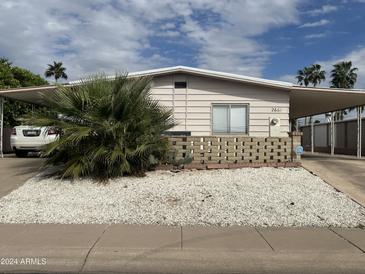 Ranch style home with carport and landscaped yard at 2661 N Higley Rd, Mesa, AZ 85215