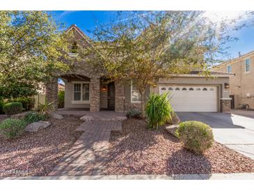 Beautiful two-story home with stone facade and landscaped yard at 2301 E Azalea Dr, Chandler, AZ 85286