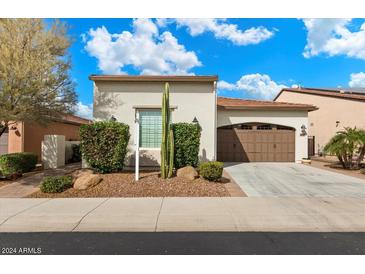 Single-story home with brown garage door and cacti at 578 E Laddoos Ave, San Tan Valley, AZ 85140