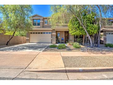 Two-story house with attached garage and landscaping at 35202 N 30Th Dr, Phoenix, AZ 85086