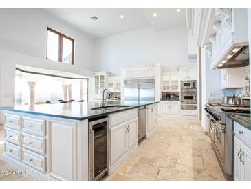 Large kitchen with island, stainless steel appliances, and custom cabinetry at 5400 E Valle Vista Rd # 6, Phoenix, AZ 85018