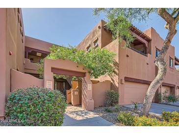 Attractive exterior of a two-story building with a walkway and garage access at 13600 N Fountain Hills Blvd # 504, Fountain Hills, AZ 85268