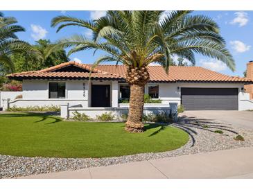 Single story home with a renovated exterior and landscaped yard at 8320 E Appaloosa Trl, Scottsdale, AZ 85258