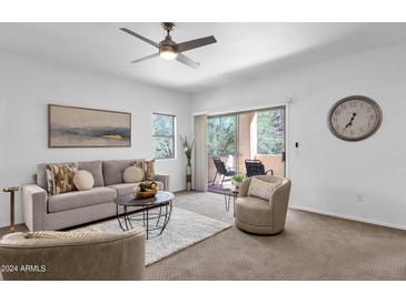 Bright living room with access to a patio at 16308 E Arrow Dr # 111, Fountain Hills, AZ 85268
