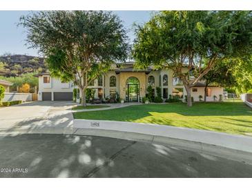 Stunning two-story home with a large front yard and mature trees at 14828 N 15Th Ave, Phoenix, AZ 85023