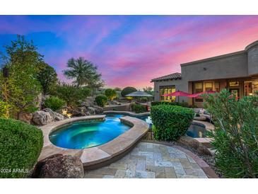 Stunning spa and pool area with a waterfall feature at 37295 N Boulder View Dr, Scottsdale, AZ 85262