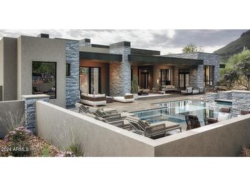 Luxury home with inviting pool, expansive patio, and modern furniture at 10071 E Aniko Dr, Scottsdale, AZ 85262