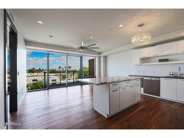 Modern kitchen with granite island and city views at 4422 N 75Th St # 4011, Scottsdale, AZ 85251
